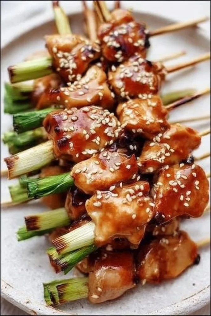 Grilled Chicken Yakitori skewers served with a savory dipping sauce
