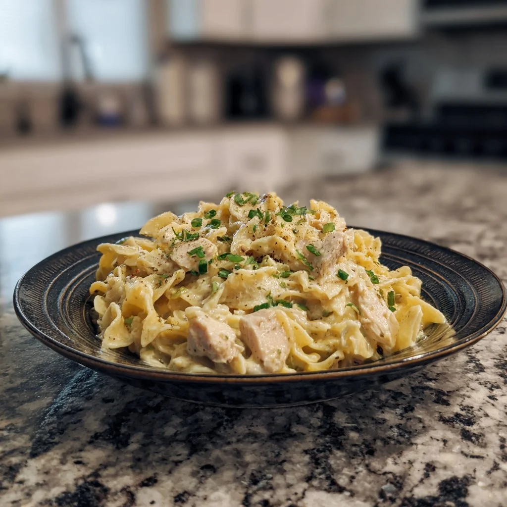 Cozy creamy chicken pasta recipe made in the crockpot for easy family meals.